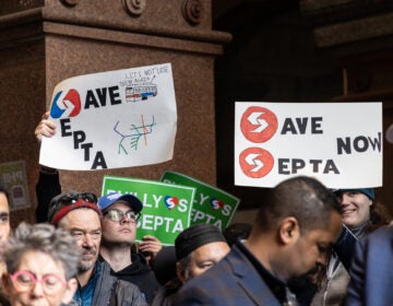 two signs among others read SAVE SEPTA and SAVE SEPTA NOW