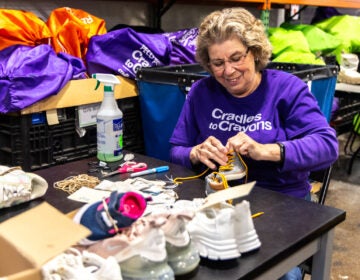 Joan Craver cleans shoes