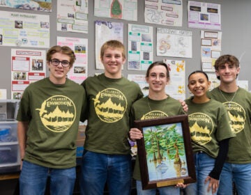 Five students posing for a photo together