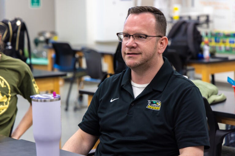 Jeff Billings sitting in his classroom