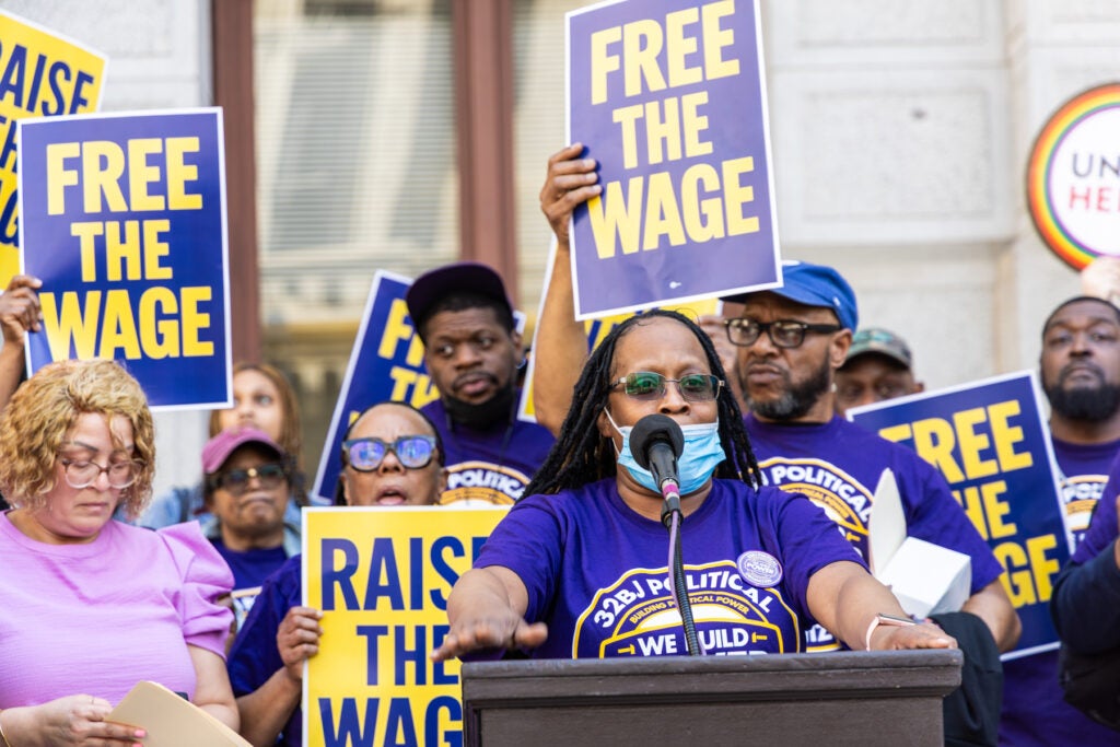 Stephanie Gibson speaking at a podium at the rally
