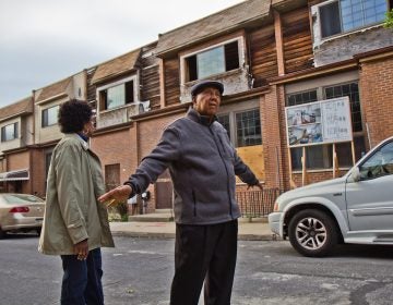 Gerald Renfrow and his wife Connie have stayed on the block despite many of their neighbors taking buyouts from the the city and are looking forward to more activity. (Kimberly Paynter/WHYY)