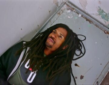 In the new MOVE documentary, '40 Years a Prisoner,' Mike Africa, Jr., visits the prison cell where he was born. (Screenshot from 40 Years a Prisoner)