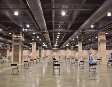 Empty chairs are seen inside the Pennsylvania Convention Center