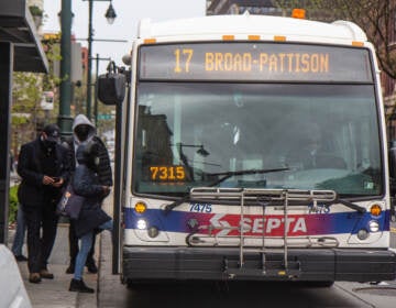 SEPTA riders board a bus in Center City, Philadelphia, on April 19, 2022. (Kimberly Paynter/WHYY)