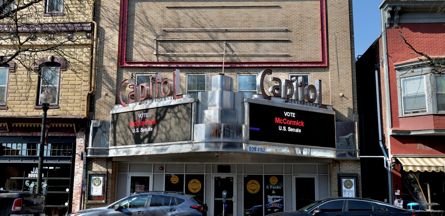 The Capitol Bar and Grill on Main Street In Bloomsburg carries an ad for Dave McCormick's Senate candidacy. (Emma Lee/WHYY)