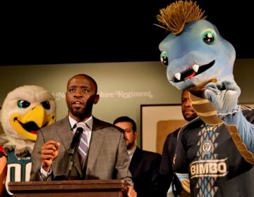 Philadelphia Union mascot, Phang, (right) mimics City Councilmember Isaiah Thomas during a press conference