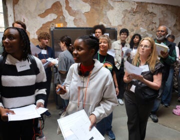 Attendees navigate different tasks during the Eastern State Penitentiary’s Reentry Simulation