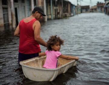 Jesus Hernandez guides granddaughter