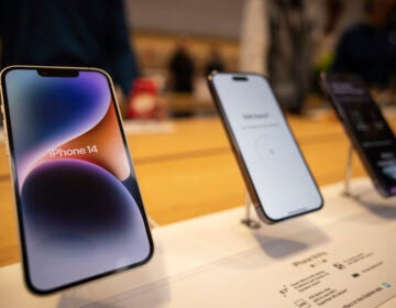 iPhones sit on display at a store