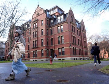 People walk on campus at Harvard University