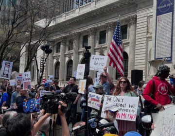 People gather to protest President Donald Trump's policies on Saturday, April 19, 2025 in New York.