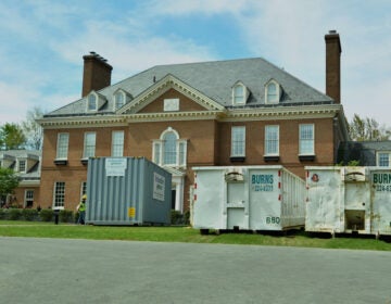 Large waste disposal bins sit out front of the Pennsylvania governor's residence