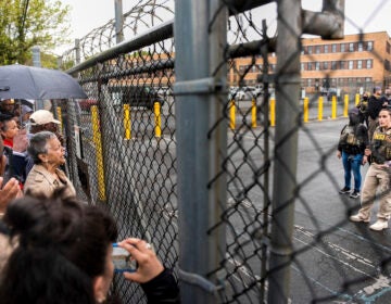 Rep. Bonnie Watson Coleman, D-N.J., speaks with an officer demanding she be let into the ICE Detention office