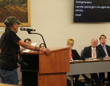 Bucks County Sheriff Fred Harran listening to residents speak out against his decision
