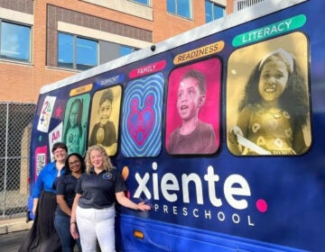 Xiente Busesito leaders stand in front of the Busesito mobile pre-K bus