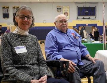 Carol Ferguson (left) and Jim Smith pose for a photo at a Post Polio Network event