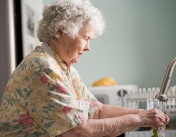Older adult washing hands