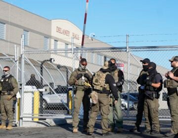 Security officers outside of the detention center