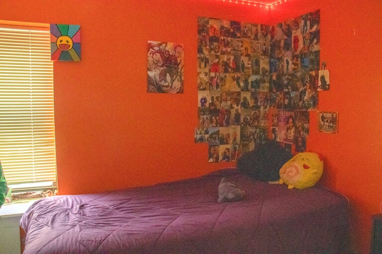 Bedroom with photos plastered all over the wall