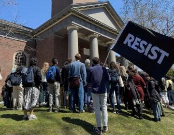 Students, faculty and members of the Harvard University community rally