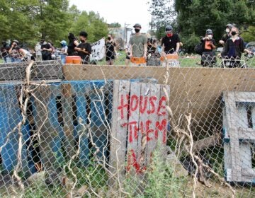 Protesters defend a homeless encampment on Ridge Avenue