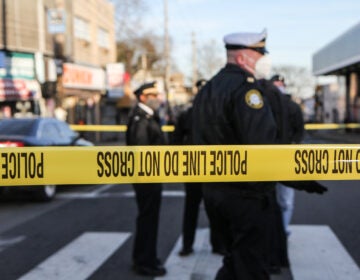 Police tape marks off a crime scene near Olney Transportation Center