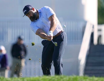 Former Philadelphia Eagles football player Jason Kelce hits on the 16th hole during a pro-am before the Truist Championship golf tournament at the Philadelphia Cricket Club, Wednesday, May 7, 2025, in Flourtown, Pa. (AP Photo/Matt Rourke)