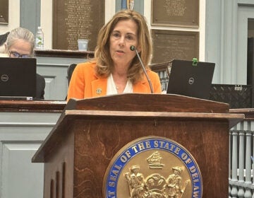 Kathy Jennings speaking at a podium