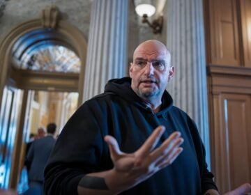 John Fetterman talks to reporters