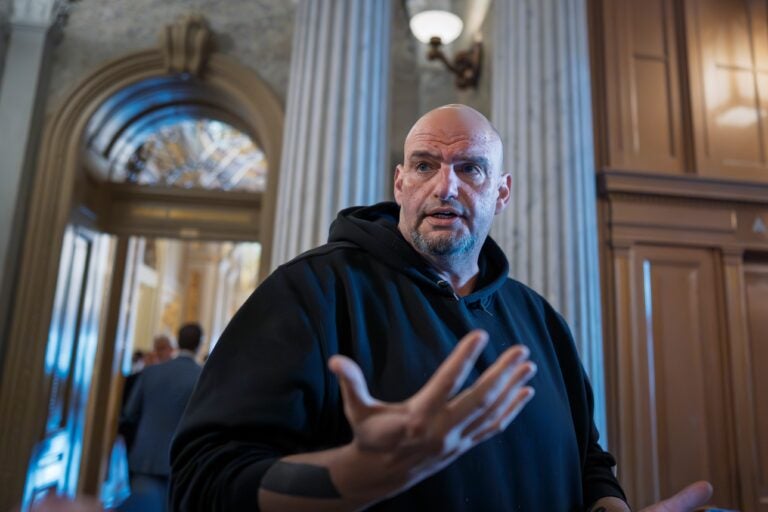 John Fetterman talks to reporters