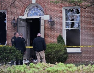 Police outside the home, the morning after the fire