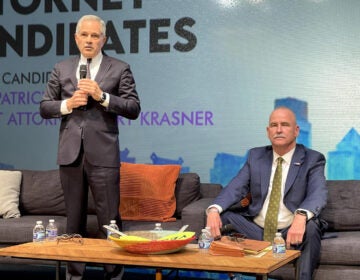 District Attorney Larry Krasner, left, and retired Municipal Court judge Patrick Dugan took part in a DA election forum.