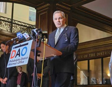 Larry Krasner speaking at a podium