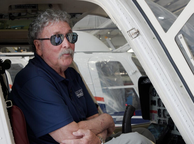 Mark Ciccone sits in a helicopter