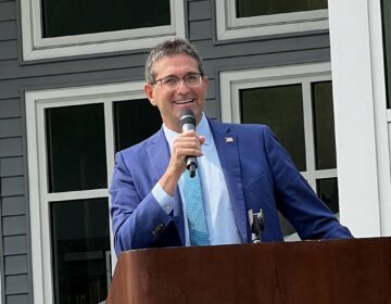 Matt Meyer speaking into a microphone