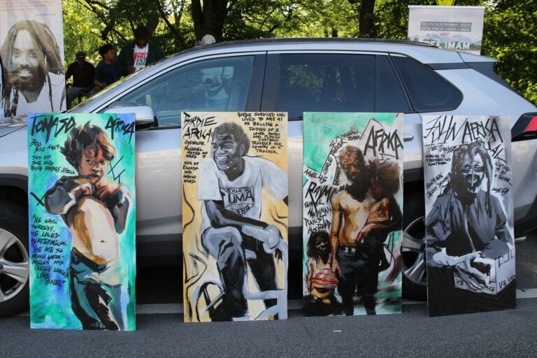 Paintings depicting victims of the MOVE bombing