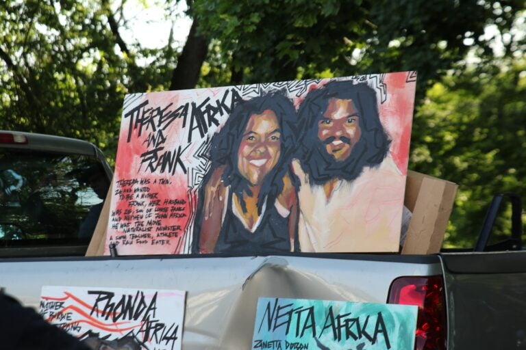 Paintings depicting victims of the MOVE bombing