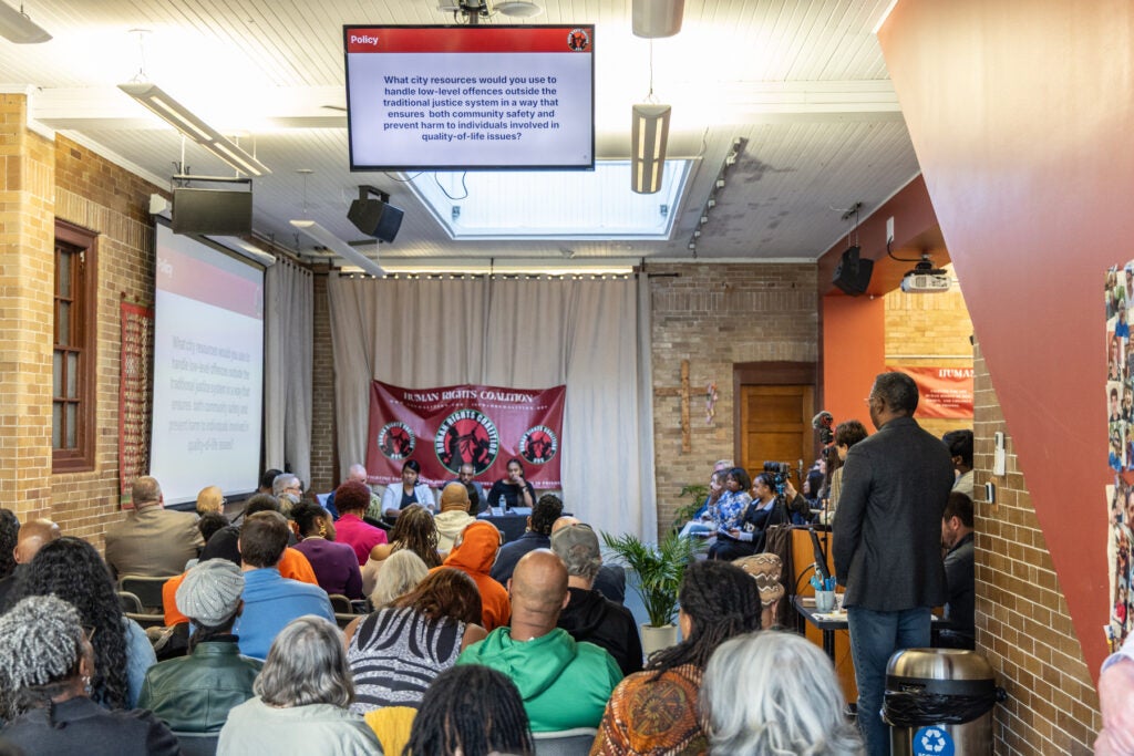 Philadelphia District Attorney Larry Krasner faces off against former judge Pat Dugan at the West Philadelphia Mennonite Fellowship district attorney forum on March 11, 2025.