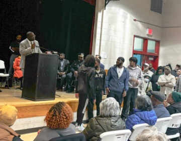 Anthony Phillips addressing a room full of people