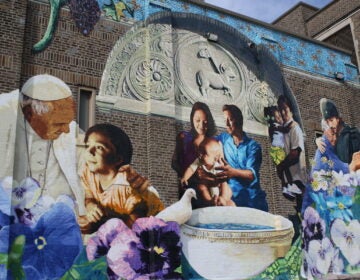 Close up view of mural on the facade of Saint Malachy School