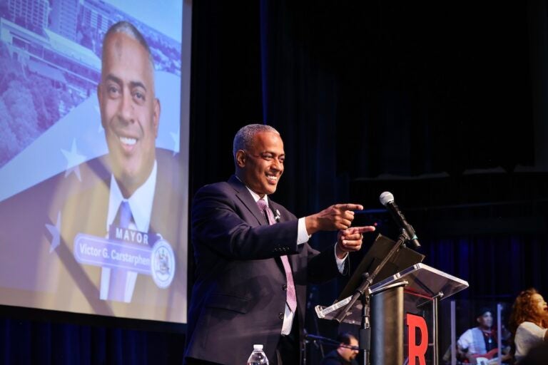 Camden Mayor Vic Carstarphen on stage at Gordon Theater