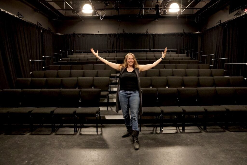 Deborah Block standing in Theatre Exile's performance space