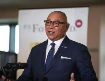Tim DeFoor speaking at a podium